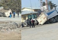 Toprağa saplanan kamyon yan yattı