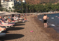 Muğla'da yaz sıcakları! Vatandaş sahilde güneşlendi..